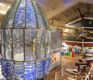 Close-up view of lens with first floor of museum in the background.