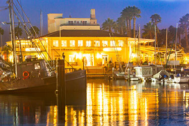 Exterior photo of the Santa Barbara Maritime Museum at night.