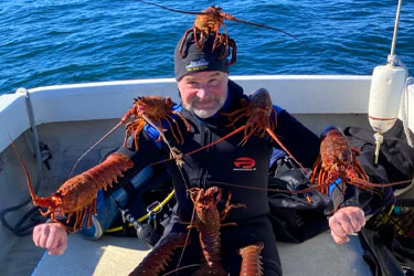 Photo of Robert Schwemmer with Lobsters